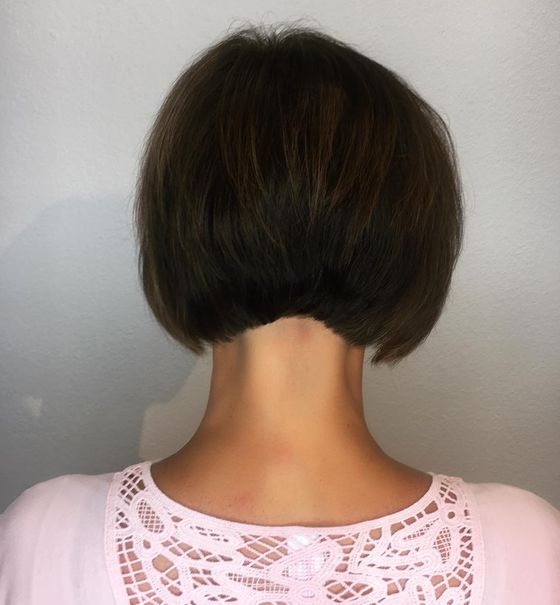 A dark brown stacked bob, cut short at the nape, seen from behind