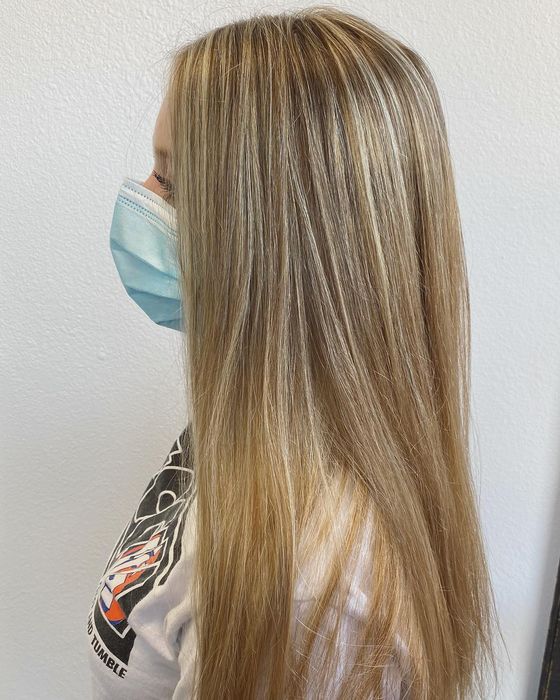 Long, straight hair with fine sandy blonde highlights, in profile